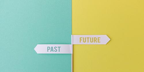 Past and future signs on a coloured background